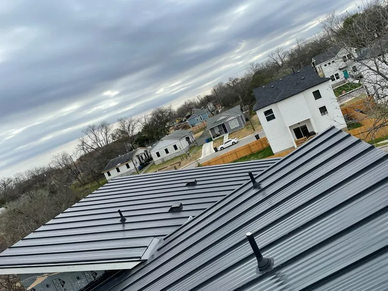 Standing seam metal roof panels with vents for Skylight Repair in Boone